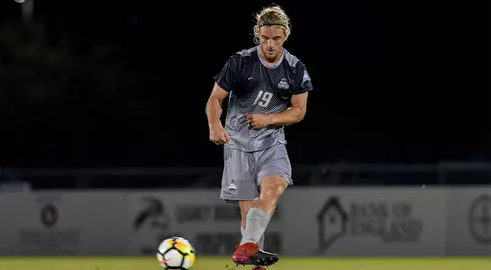 Micah Smoak kicks a ball