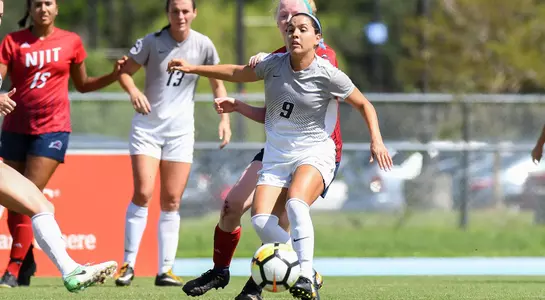 Lisa Cedeno steals the ball from the opponent.