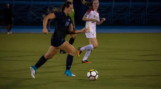 Hannah Menendez kicks the soccer ball.
