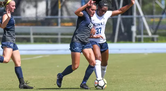 Andrea Sanchez steals the ball from her opponent.
