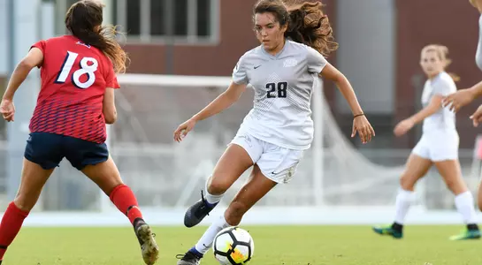 Andrea Sanchez kicks the soccer ball.