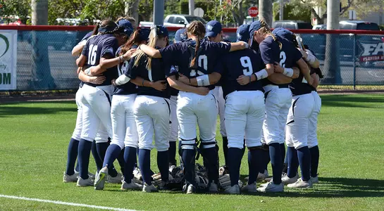 Softball huddles before a game.