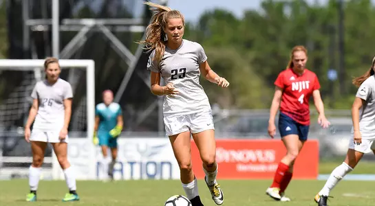 Krista Colubiale dribbles the soccer ball against NJIT