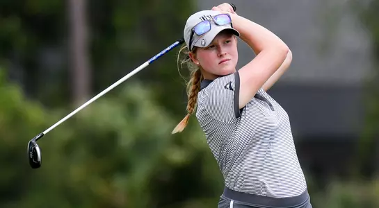 Teresa Conroy hits a tee shot