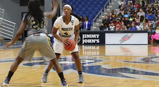 Adrienne Jackson posts up against Warner.