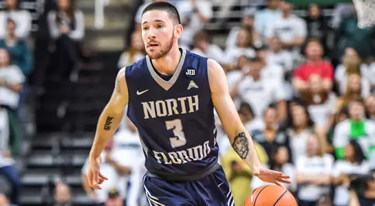 JT Escobar dribbles the basketball