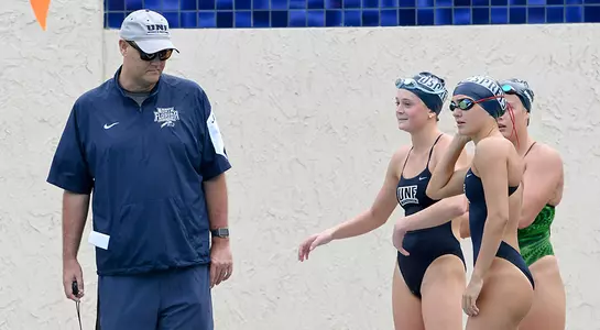 Swimming coach Ian Coffey talking to swimmers