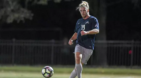 Micah Smoak kicks a ball