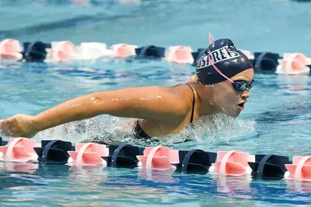 Sydney Groff strokes the butterfly at a swim meet.