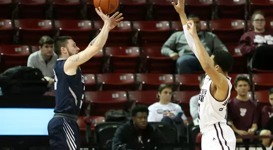 JT Escobar takes a jump shot over a Mississippi State defender