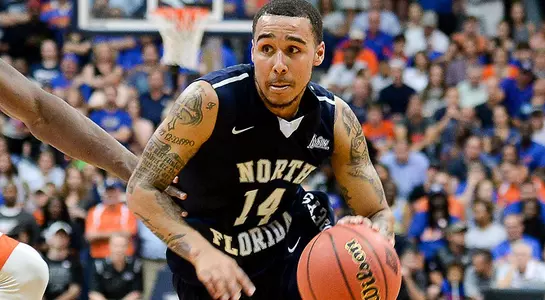 Dallas Moore drives the ball to the basket