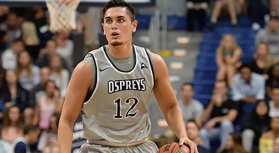 Aaron Bodager dribbles the basketball in a game at UNF Arena