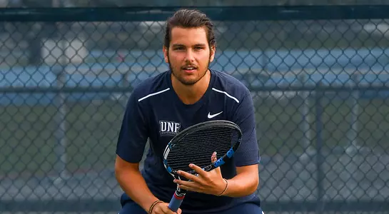 A. deMeo poses with his racquet