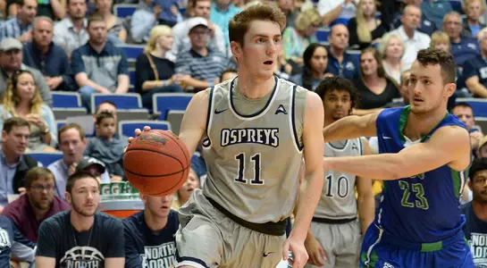Garrett Sams drives the ball to the basket past a defender