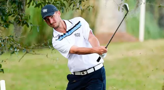 UNF golfer Travis Trace hits a shot from rough