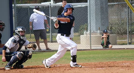 A UNF baseball player swing his bat and gets a hit