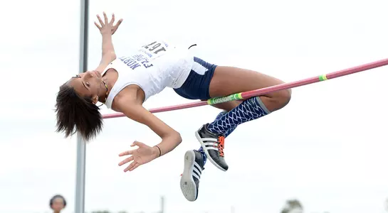 Alyssa Young clears the bar in the high jump
