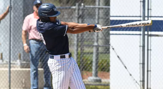 Christian Diaz takes a swing at a ball