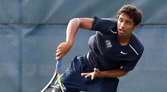 Deshmukh serves a ball to an opponent