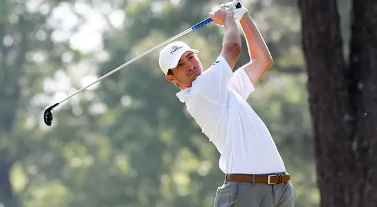 Travis Trace poses on his swing follow through