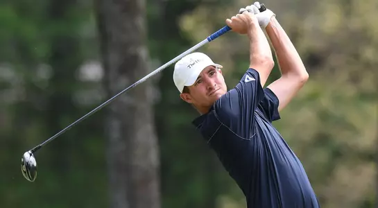 Travis Trace makes a golf swing