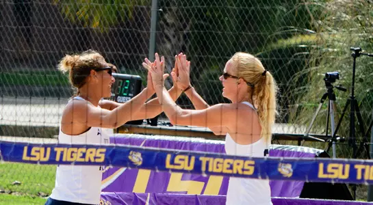 McPherson and DeBolt celebrate after winning a point.