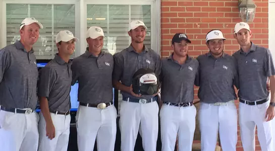 The UNF men's golf team poses with trophy after winning the Irish Creek Intercollegiate