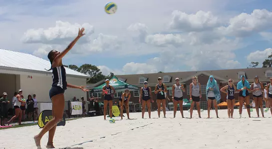 Gabby O'Connell serves the volleyball
