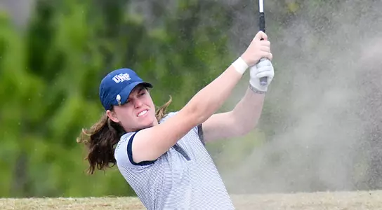 Courtney Cobb hits shot from sand bunker