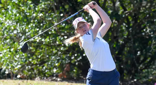 Teresa Conroy hits a tee shot