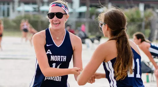 Sami Mims and Madilyn McCarty celebrate a point