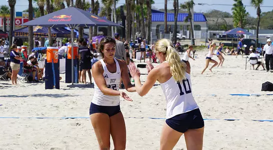 Taryn Griffey and Sadie Thurston celebrate a point