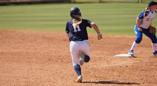 Macayla Kelley runs towards second base