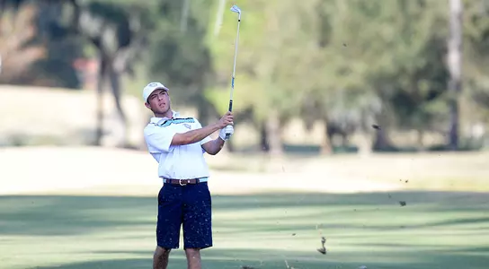 Jordan Batchelor hits a shot from the fairway