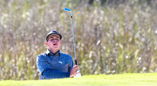 Michael Mattiace hits a sand shot from a bunker