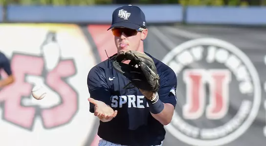Mac Wilson catches the baseball