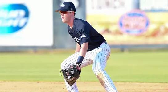 Mac Wilson stands near second base