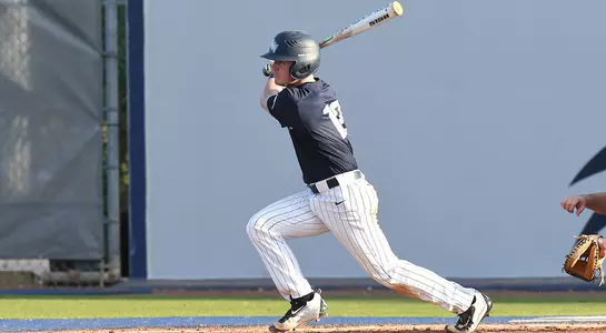 Mac Wilson hits the baseball