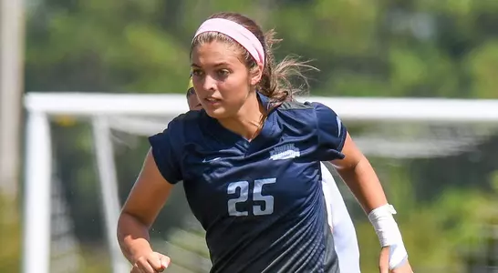 Madi Sagas runs up the soccer field.
