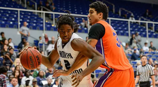 Wajid Aminu drives on an opponent