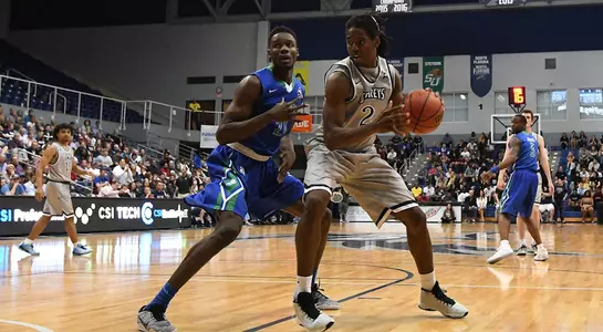 Wajid Aminu drives on a FGCU player