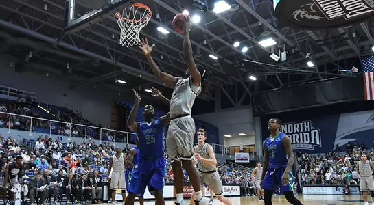 Wajid Aminu dunks the basketball