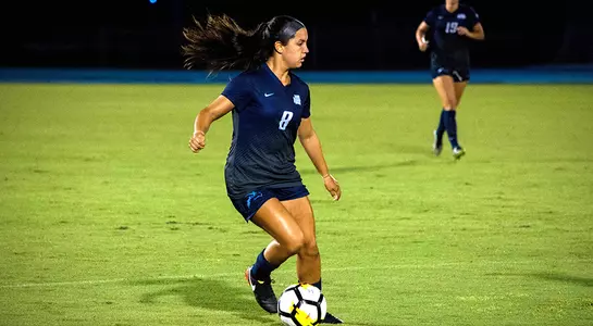 Lorena Cedeno dribbles the ball against Elon.