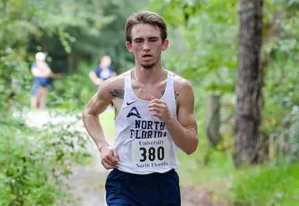 Sem Sultanov runs on trails of UNF XC Course