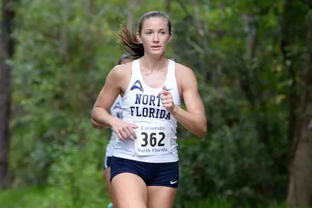 Hannah Evans runs on path in UNF XC Invitational