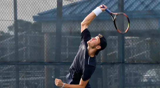 Lasse Muscheites serves up the tennis ball.
