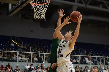 Trip Day makes a layup over an opponent