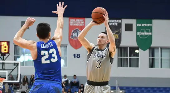 JT Escobar hits a three-pointer against FGCU.