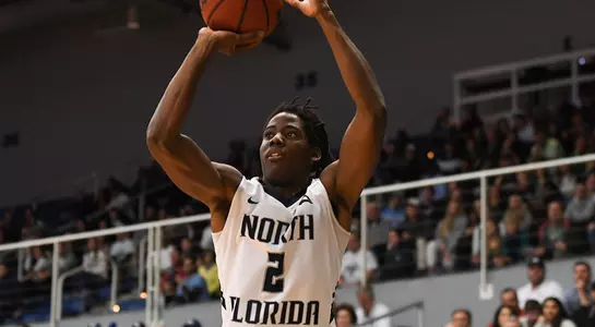 Wajid Aminu shoots the basketball
