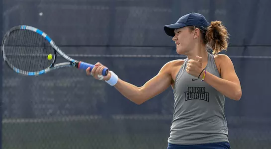 Constanza Gorches returns a tennis ball with her forehand